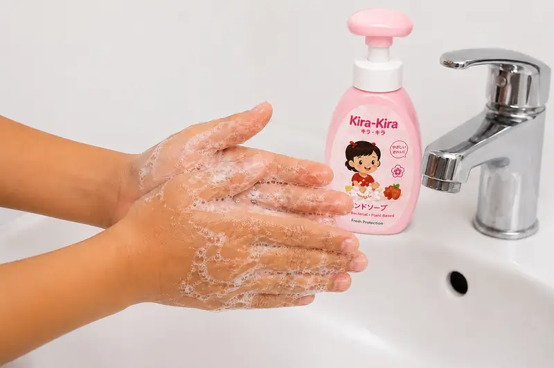 Palms being rubbed together with soap.